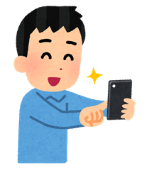 Man smiling while holding a phone